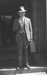 Man in a three piece suit smoking a pipe 19301940