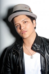 Bruno Mars tilts his hat back with his casual leather jacket.Also, the smaller brim fits his smaller frame.