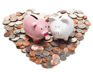 Boy and Girl Piggy Banks on Coin Heart